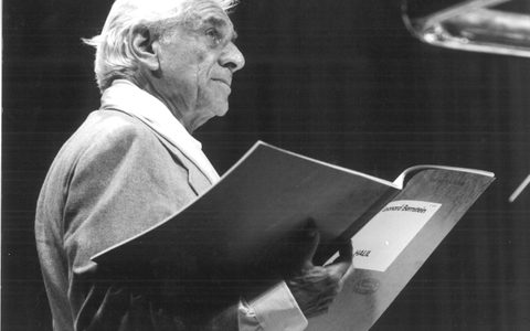 Bernstein holding a score