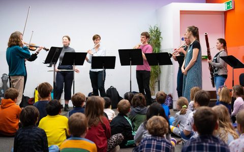 Children watching and listening to performers