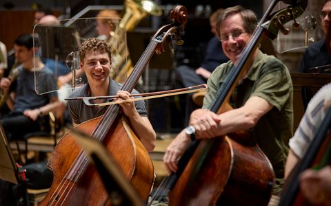 Orchestral Artistry student with an LSO member, both holding their double bass.