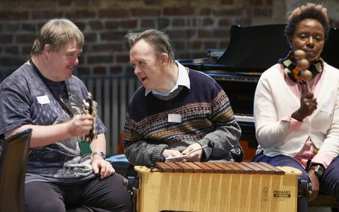 Adults talk and play musical instruments