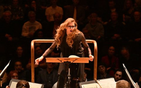 Barbara Hannigan conducting the LSO on the Barbican stage, pictured face-on