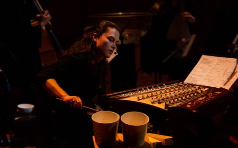 Manta playing a yangqin.