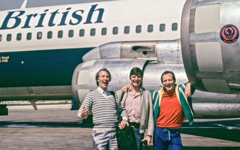 Nigel with two other orchestra members standing in front of a plane