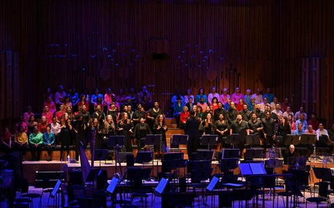 Soul Sanctuary Choir singing on the darkly lit Barbican stage