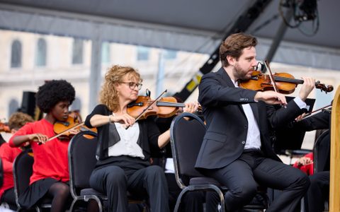 Members of the LSO strings section and LSO Discovery players performing at BMW Classics.