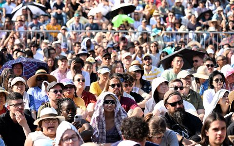 Crowds in the sunshine watching BMW Classics 2023 in Trafalgar Square