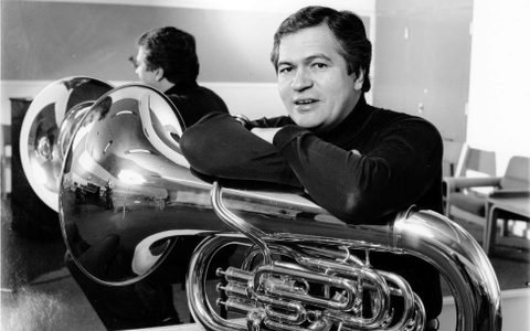 patrick sitting with his arms on top of his tuba