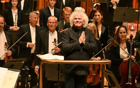 Sir Simon Rattle with the LSO on the Barbican stage